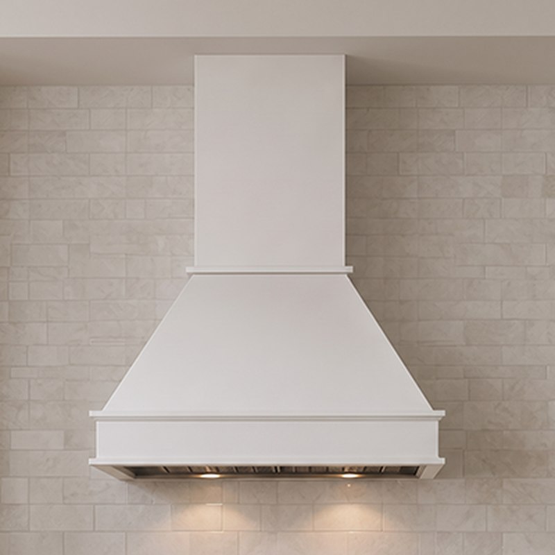 B2BCabinet Elements white finish wood range hood — studio product shot on a soft warm background